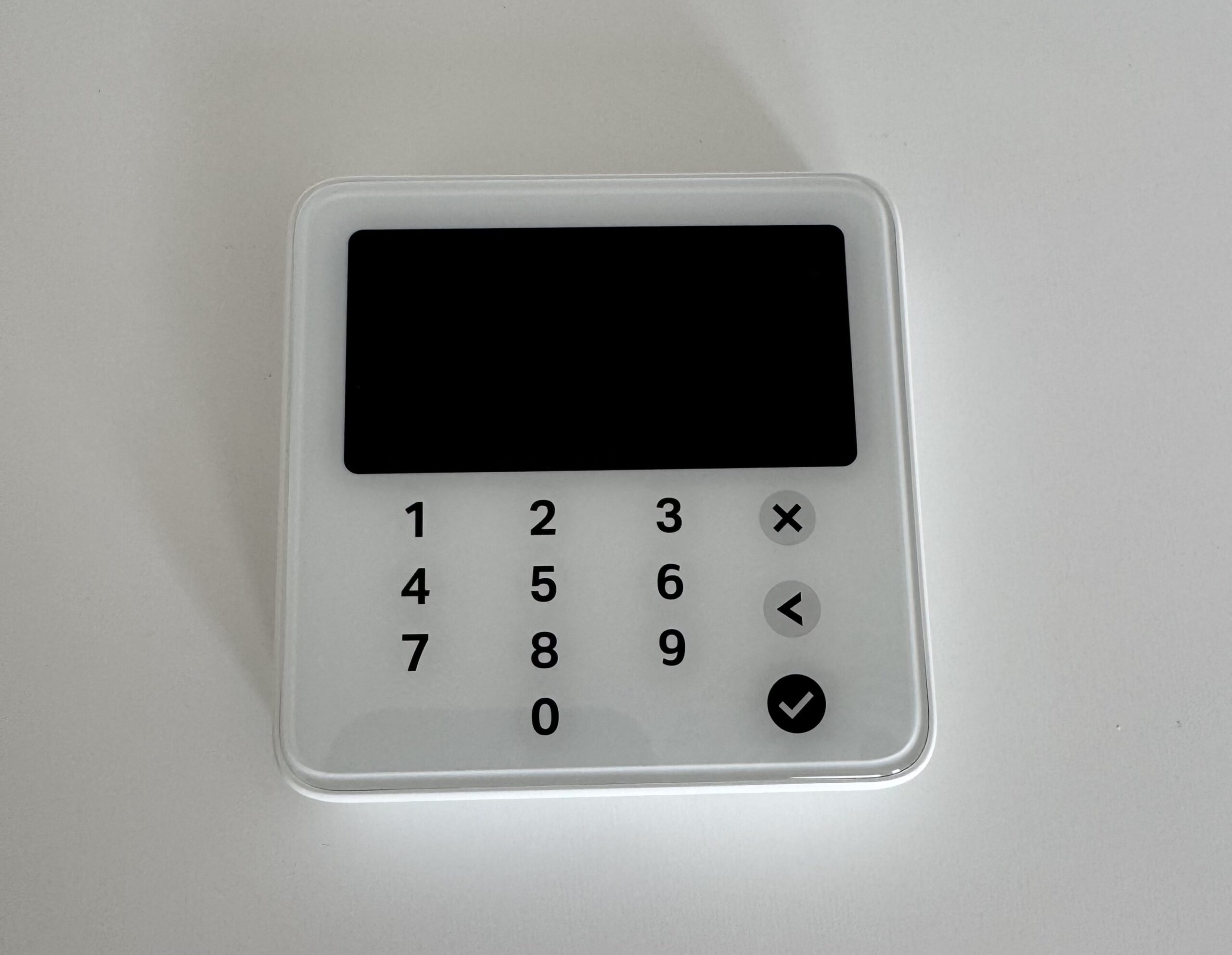 SumUp Solo Lite card reader photographed front-on, the cheapest SumUp reader